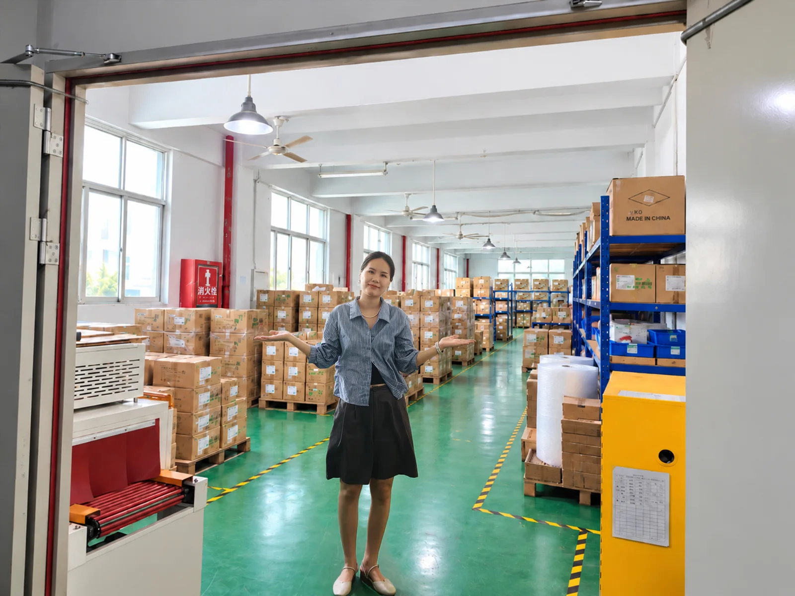 Cassiel standing in the warehouse aisle